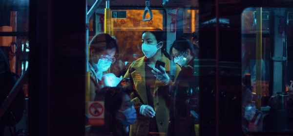 people inside a bus wearing masks