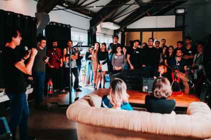 group of people standing inside room