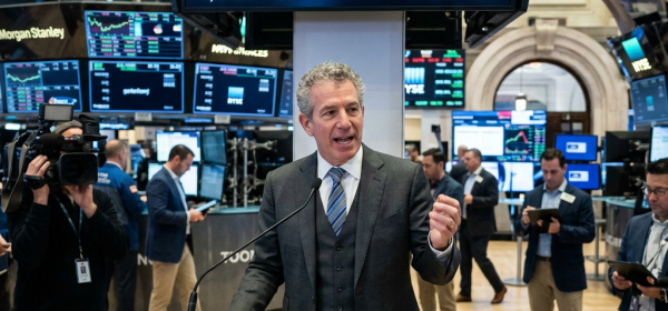 Morgan Stanley executive speaking at a podium during the launch of ETH and SOL ETFs at the stock exchange